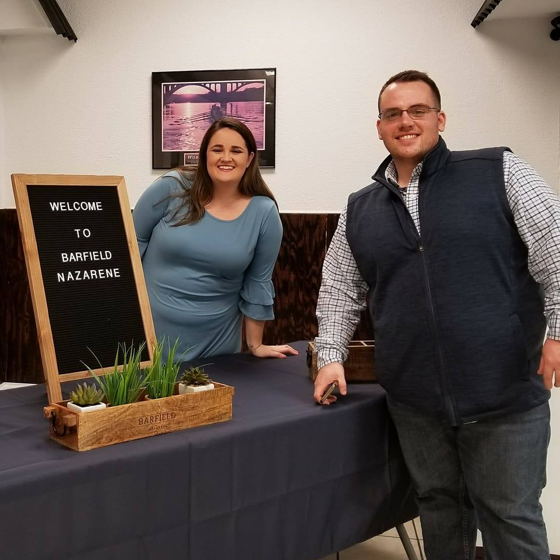 Image of two people working at the church